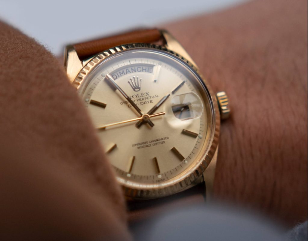 rolex day date on mans wrist