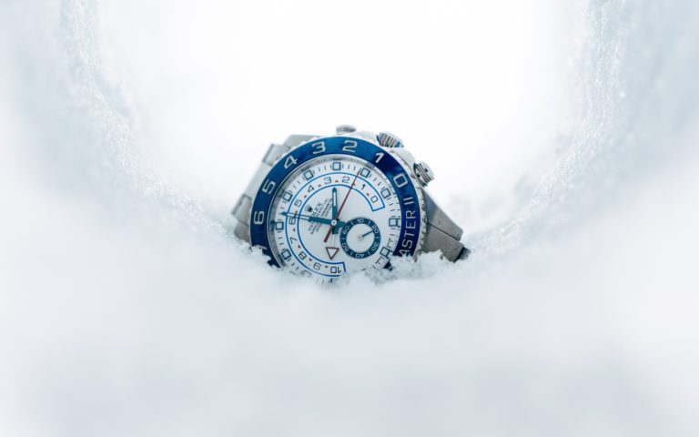 Rolex Watch Halfway In Snow