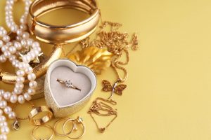 gold jewelry, rings on a yellow background