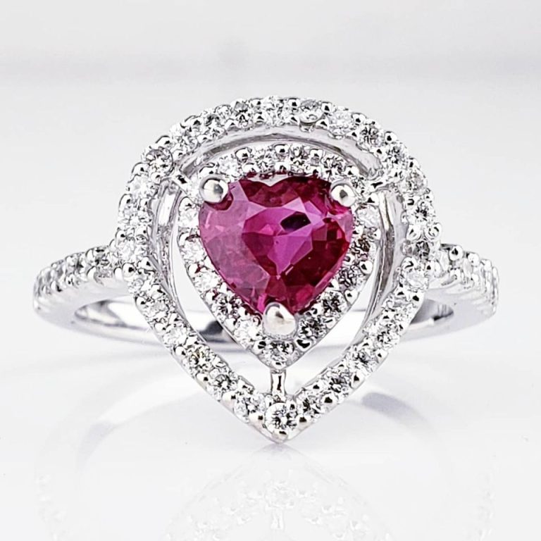 Diamond engagement ring with heart shaped emerald
